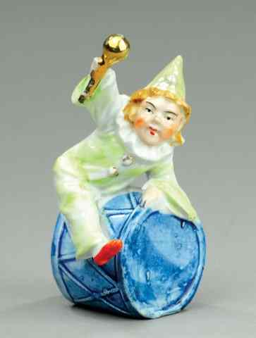 Appraisal: CLOWN ON DRUM STILL BANK Porcelain colorful example clown depicted