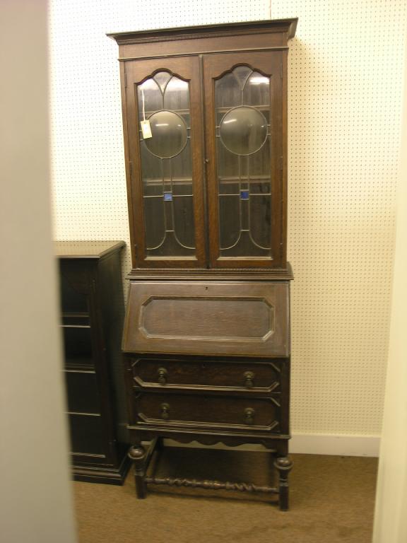 Appraisal: A 's solid dark oak bureau bookcase leaded glazed doors