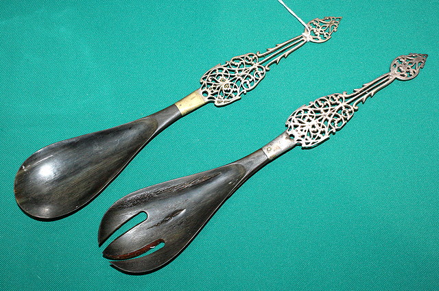 Appraisal: A PAIR OF WHITE METAL AND HORN SALAD SERVERS with