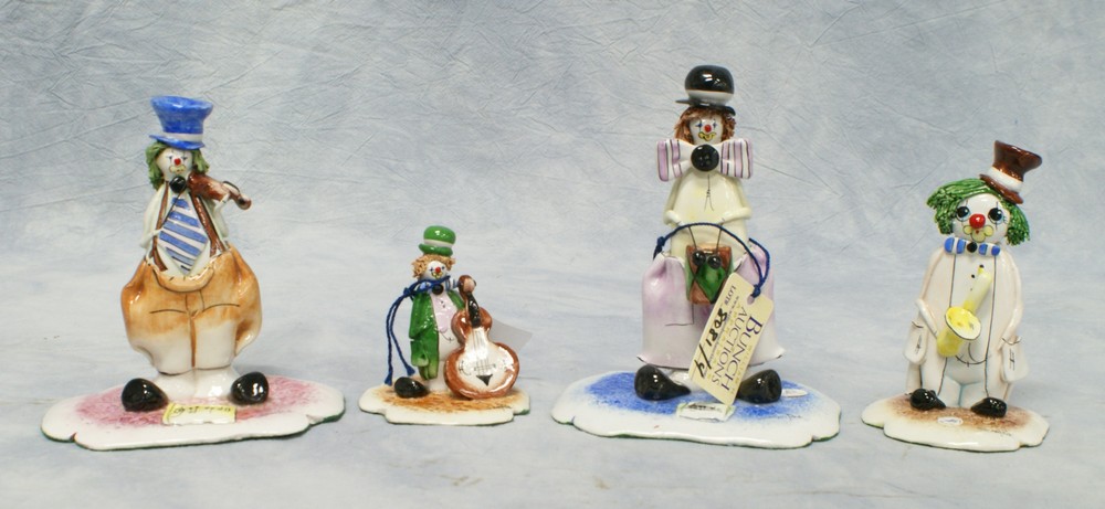 Appraisal: Zanpiva clown figurines drum saxophone violin string bass tallest