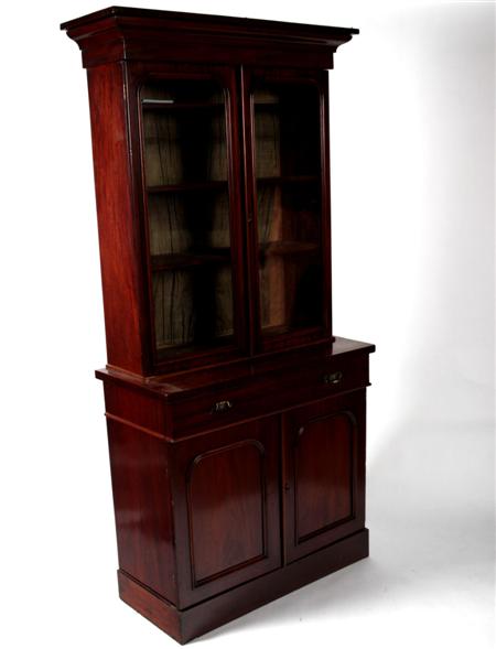 Appraisal: A Victorian mahogany bookcase and undercabinet the projected moulded cornice