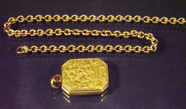 Appraisal: ct gold floral chased locket and a gold chain