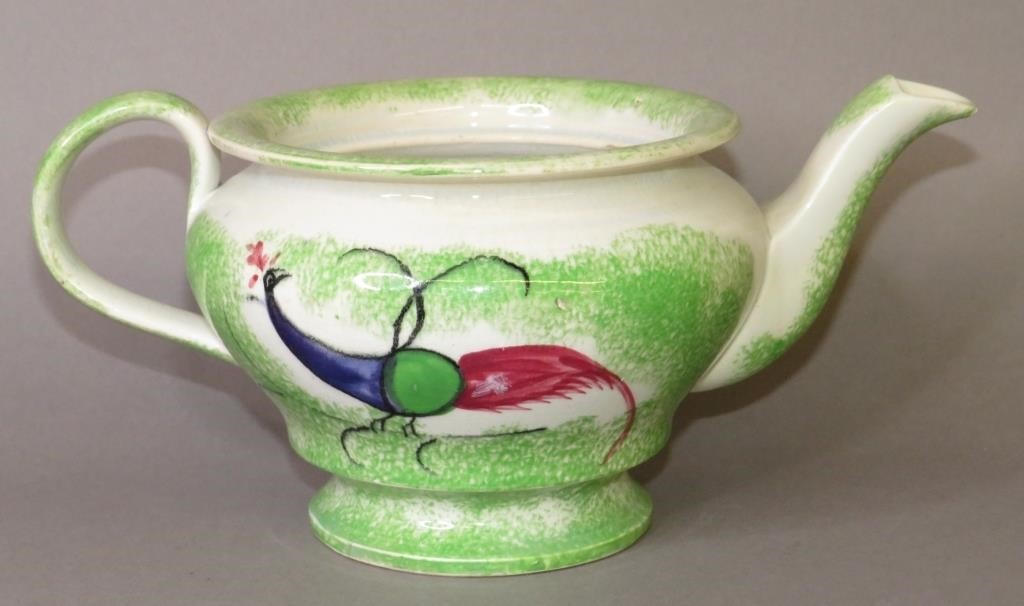 Appraisal: GREEN SPATTER PEAFOWL PATTERN TEAPOTca baluster form teapot in Peafowl