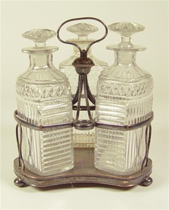 Appraisal: Silverplate Caster Set Three mold-blown crystal bottles with fitted stoppers