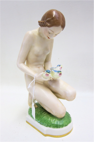 Appraisal: HUTSCHENREUTHER PORCELAIN FIGURINE of a nude female kneeling with blue