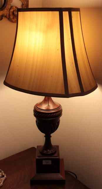 Appraisal: A PAIR OF WOODEN TABLE LAMPS in the form of