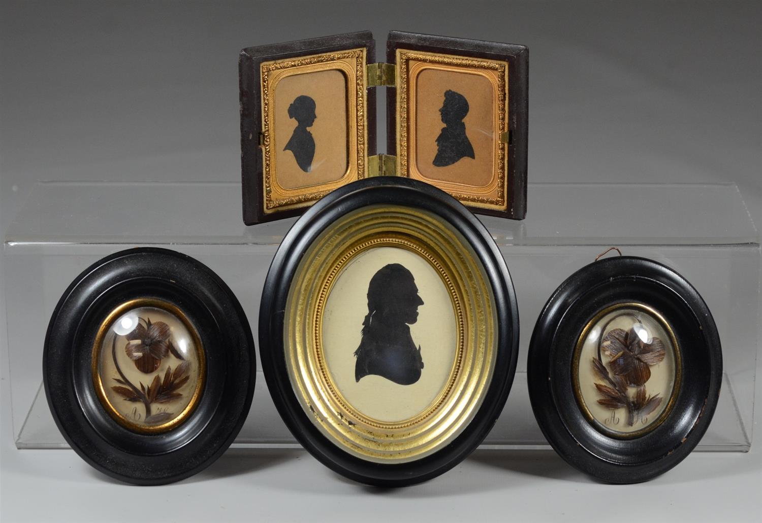 Appraisal: Pair painted silhouettes of a couple in a Union case