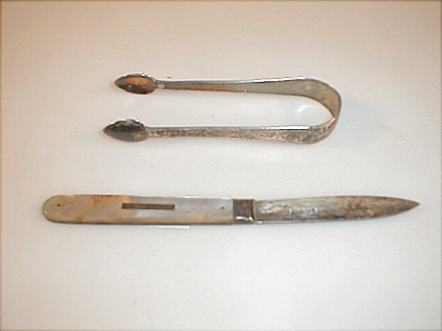 Appraisal: A pair of Georgian silver bright cut sugar nips and