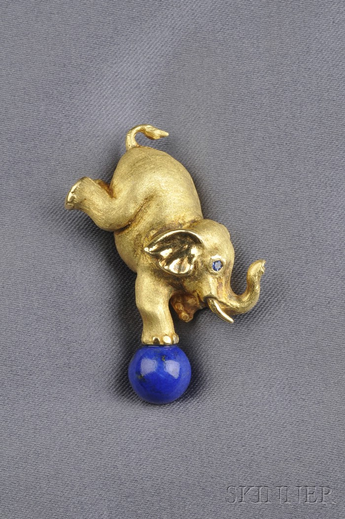 Appraisal: kt Gold Elephant Brooch with a sapphire eye holding a