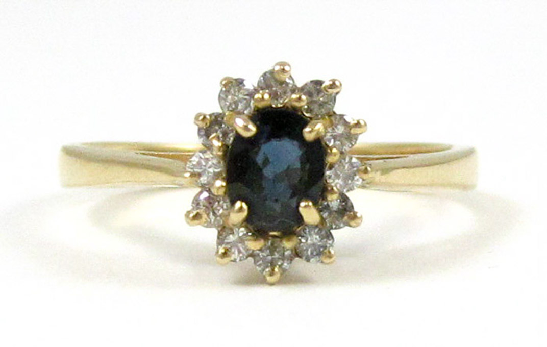 Appraisal: SAPPHIRE DIAMOND AND FOURTEEN KARAT GOLD RING with twelve round-cut