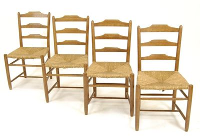 Appraisal: Four rush seated ladderback chairs designed by Ernest Gimson unsigned