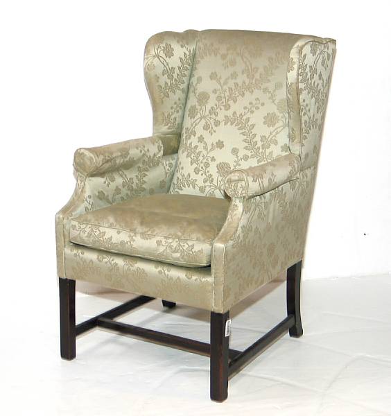 Appraisal: A George III style mahogany wing chair late th century