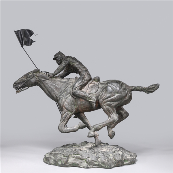 Appraisal: Metal model of horse and rider holding flag base is