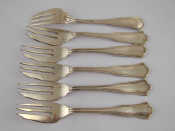 Appraisal: A set of six white metal tests silver pastry forks