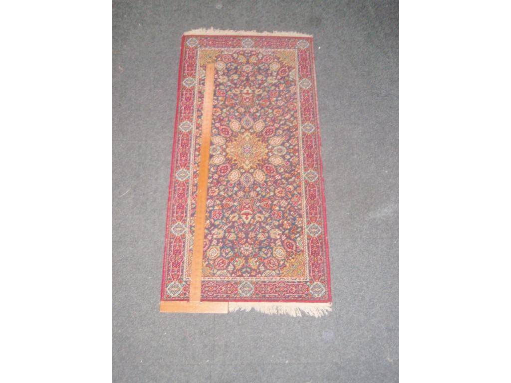 Appraisal: Three machine-made rugs cm x cm cm x cm cm