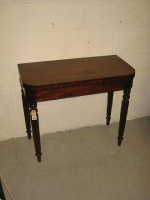 Appraisal: A MAHOGANY FOLDING CARD TABLE of D form the swivel