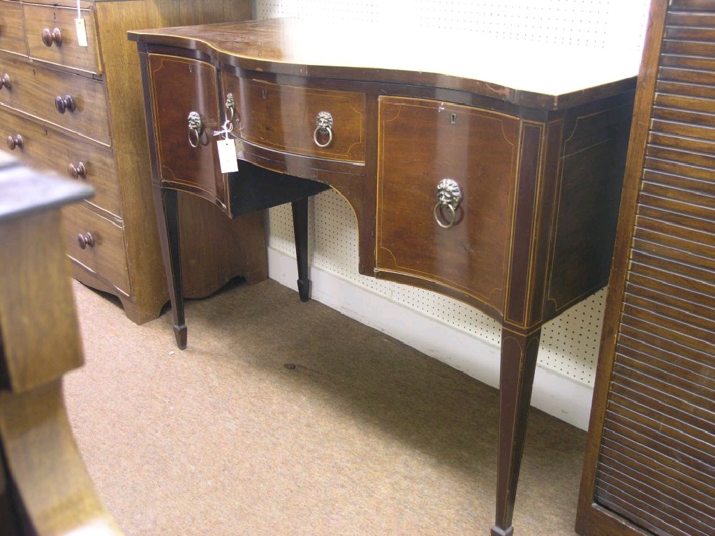 Appraisal: A George III style inlaid mahogany sideboard serpentine fronted with