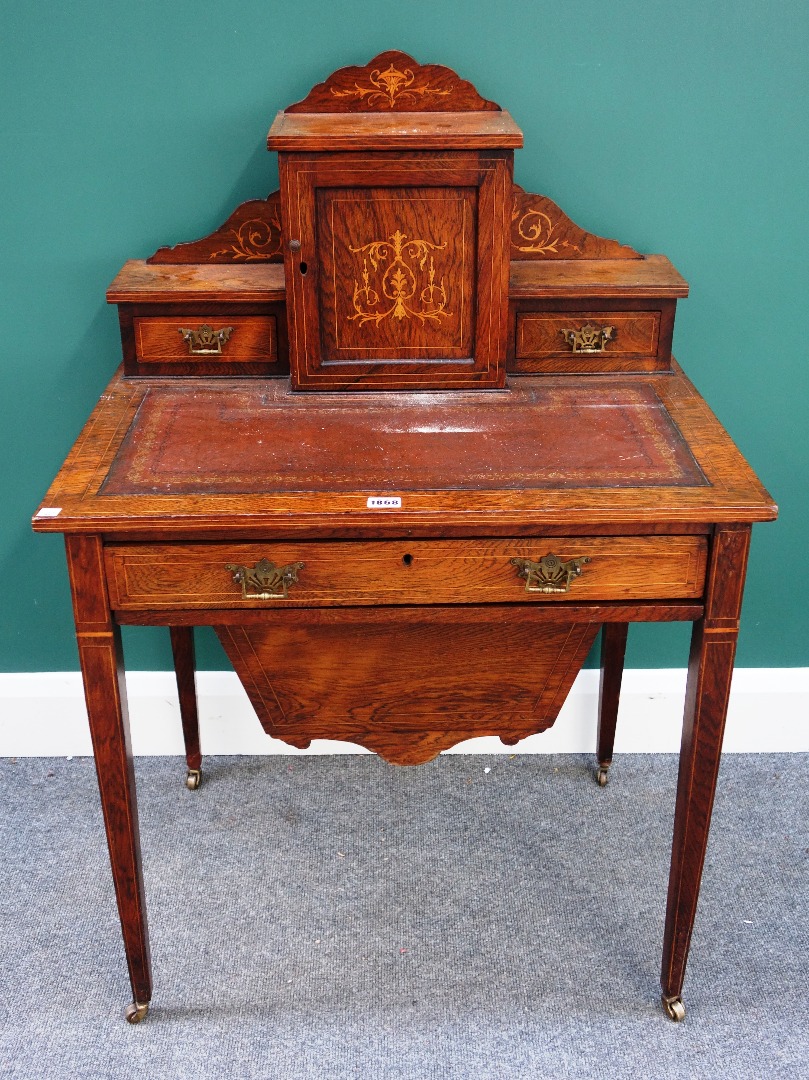 Appraisal: A late Victorian marquetry inlaid rosewood writing sewing desk the