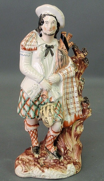 Appraisal: Staffordshire figure of a Scottish bagpiper h x w