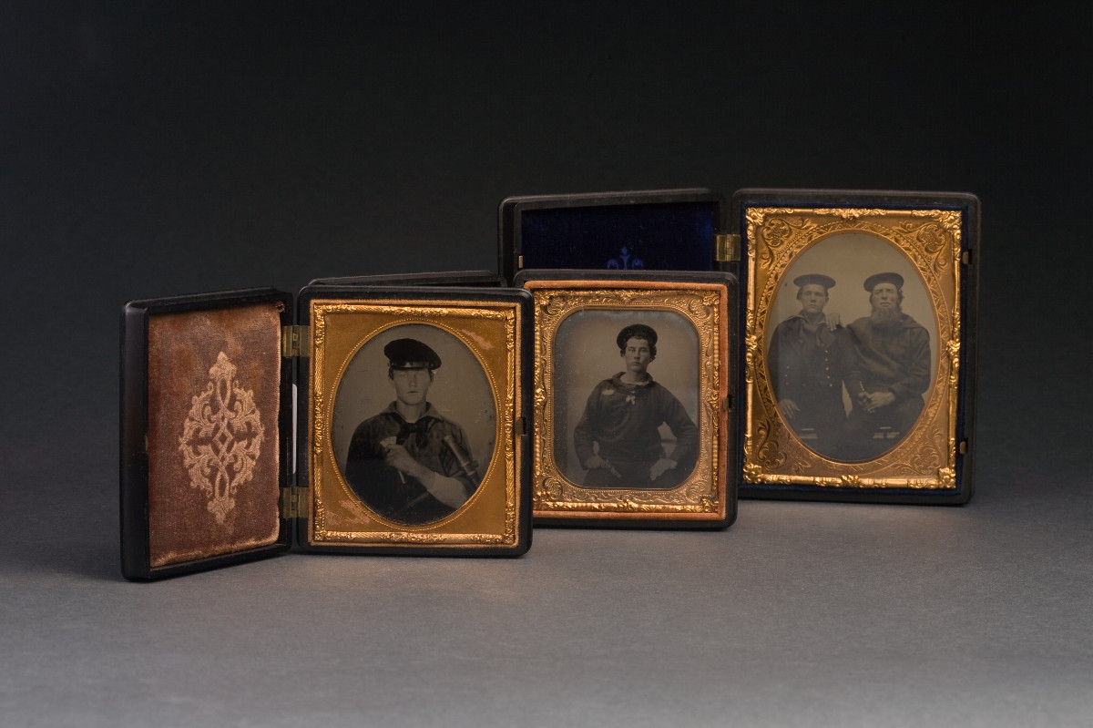 Appraisal: THREE AMBROTYPES OF SAILORS IN ELABORATE GUTTA-PERCHA CASES TOGETHER WITH