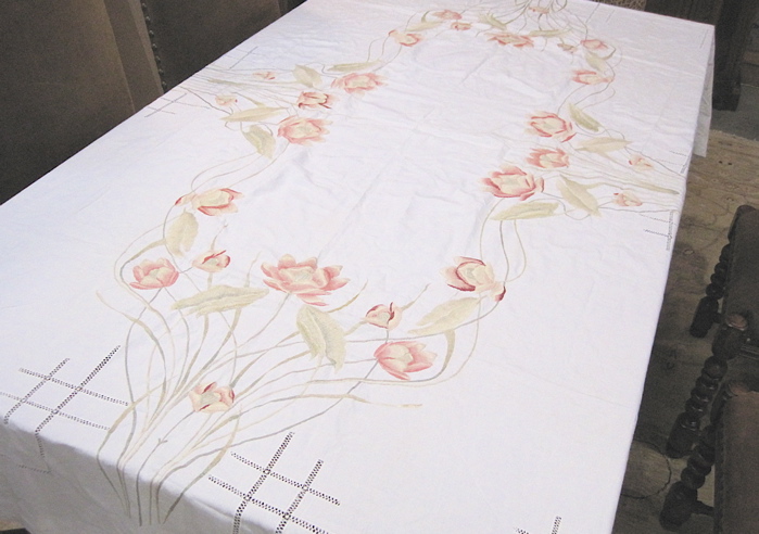 Appraisal: HAND EMBROIDERED LINEN TABLECLOTH with large floral border Dimensions L