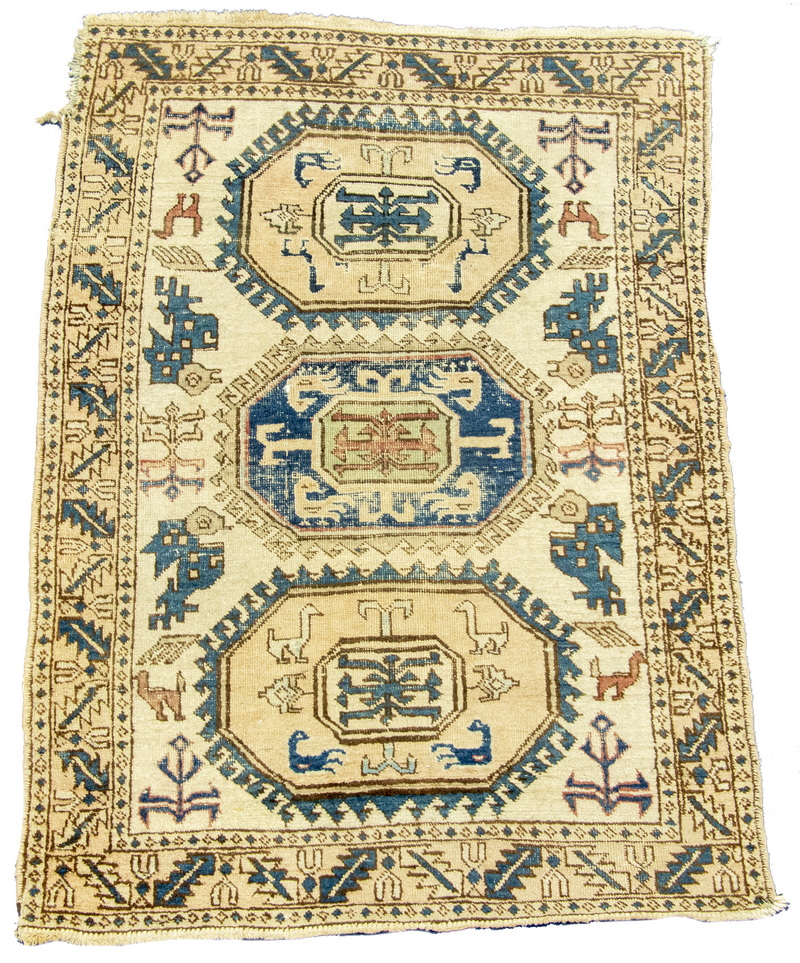 Appraisal: KAZAK RUG Three hooked octagonal medallions in gold navy blue