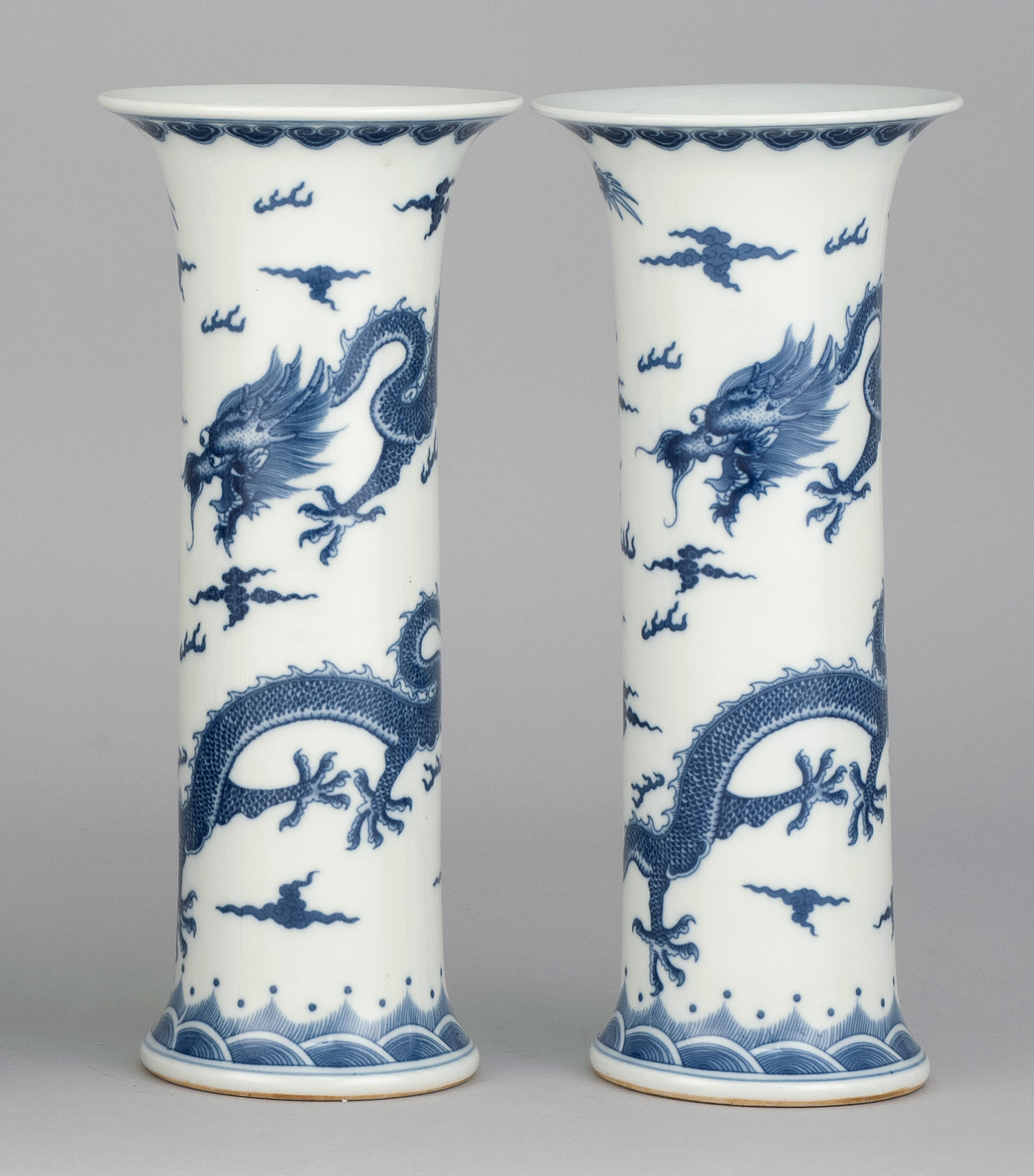 Appraisal: PAIR OF BLUE AND WHITE PORCELAIN VASES In trumpet form