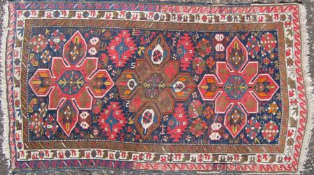 Appraisal: KARABAGH RUG EARLY TH CENTURY the indigo field with three