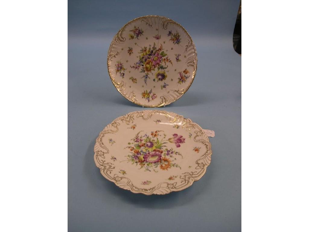 Appraisal: Two Dresden porcelain wall plates brightly painted with Deutsche Blumen