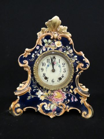 Appraisal: Majolica Pottery Mantle Clock elegant floral on cobalt fancy dial