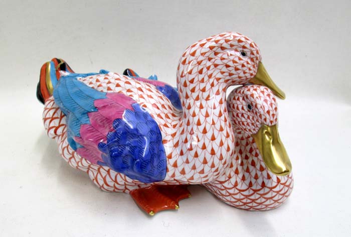 Appraisal: HEREND PORCELAIN DUCKS FIGURINE with rust fishnet colorful wings and