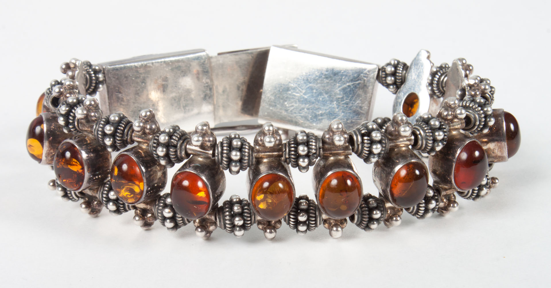 Appraisal: Amber and sterling silver link bracelet in L grams