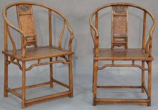 Appraisal: Pair of Chinese hardwood horseshoe back armchairs each having dragon