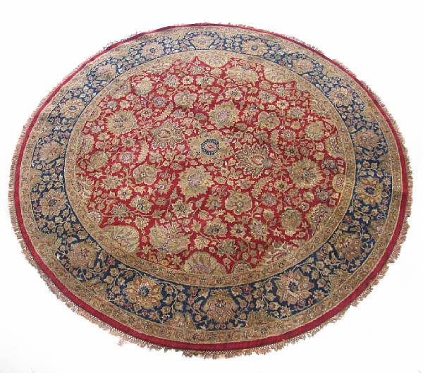 Appraisal: An Indian hand-knotted round carpet size of diameter approximately ft