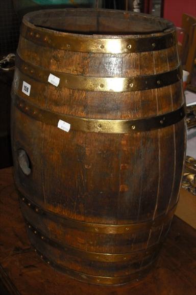 Appraisal: An umbrella stand in the form of a wooden barrel