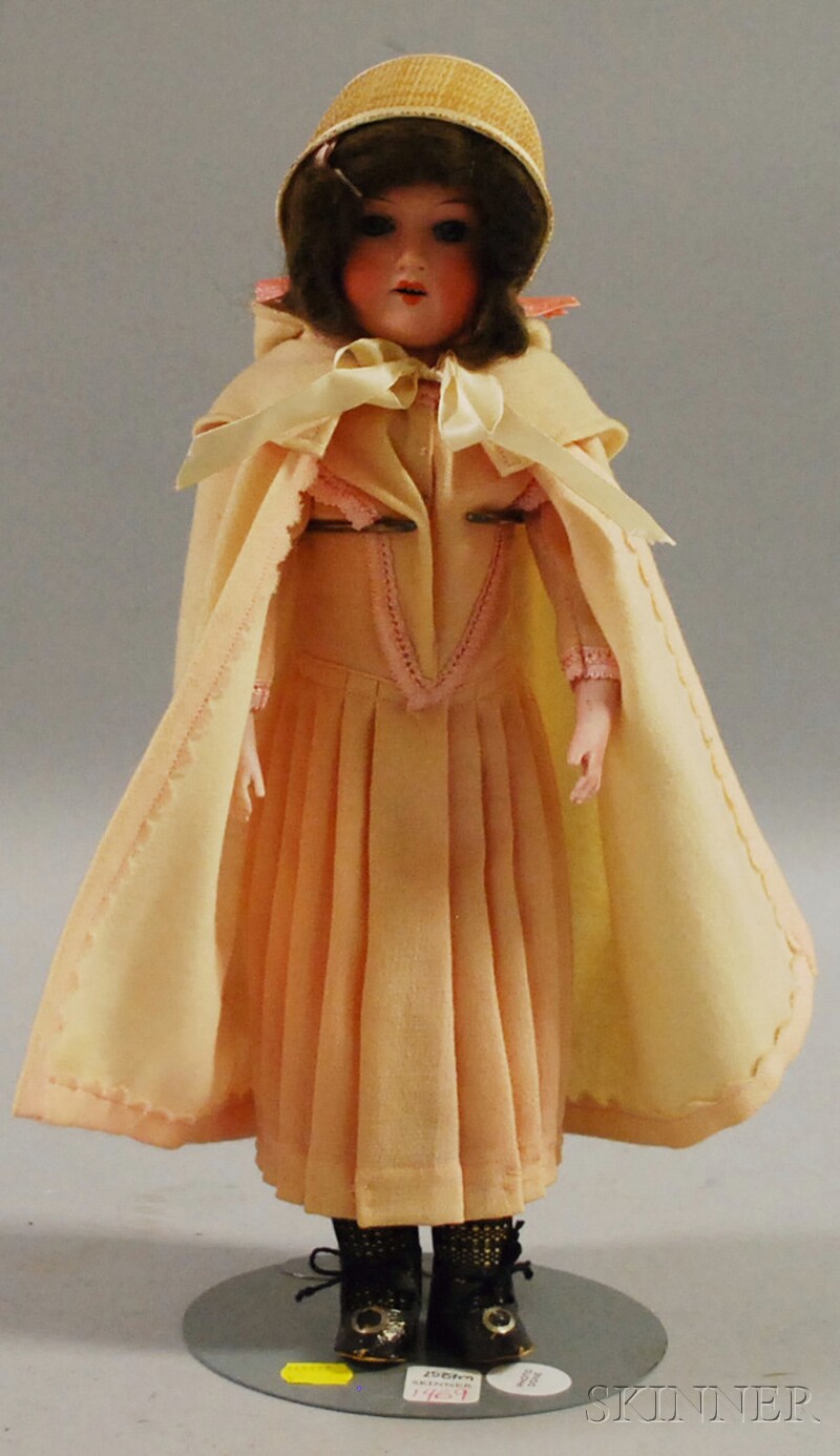 Appraisal: Armand Marseille Bisque Shoulder Head Doll with Shaker Straw Bonnet