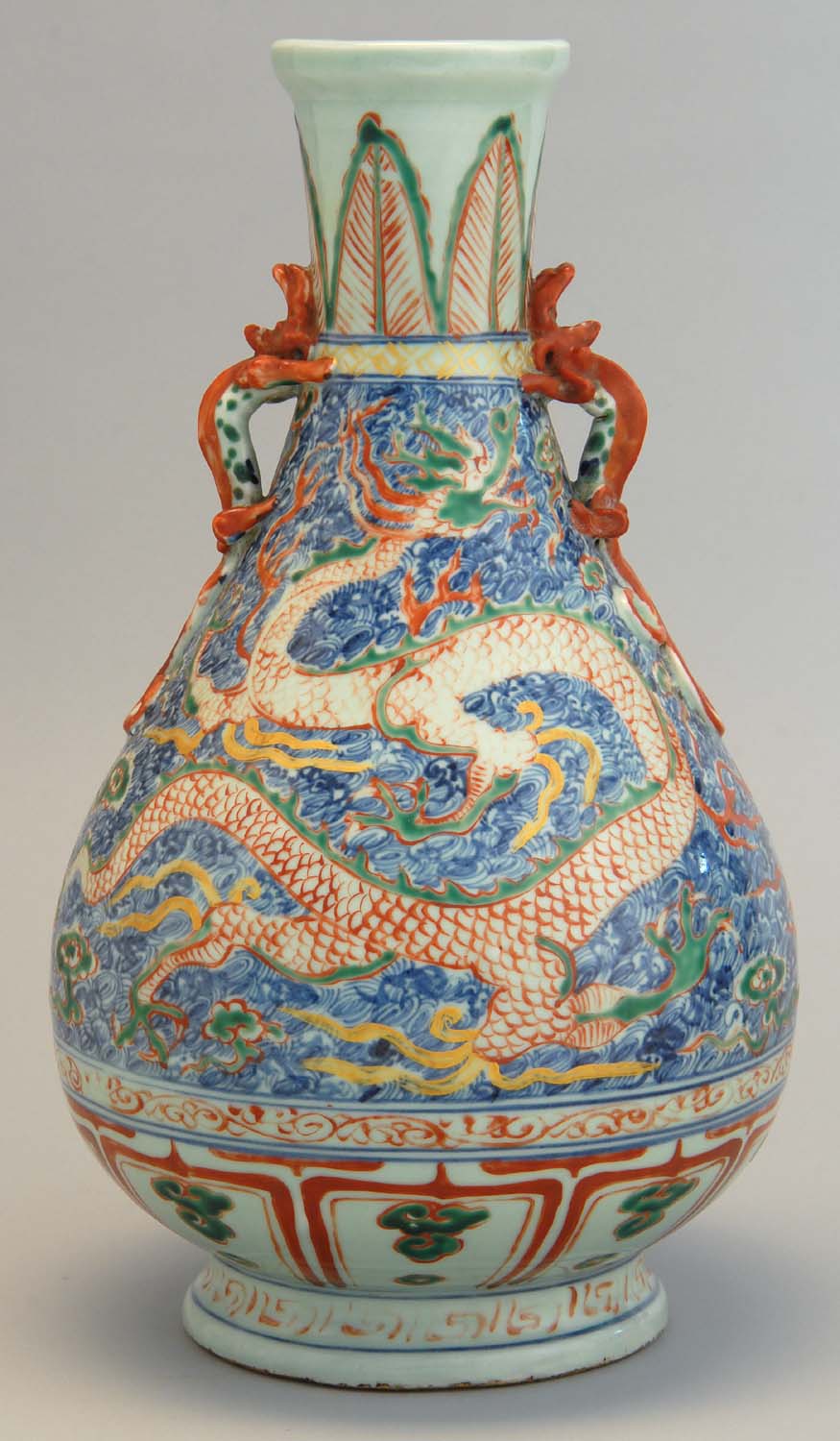 Appraisal: POLYCHROME PORCELAIN VASE th CenturyIn pear shape with dragon handles