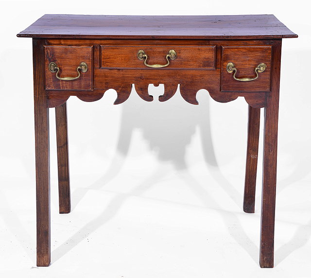 Appraisal: AN ANTIQUE FRUITWOOD LOWBOY with three drawers and square legs