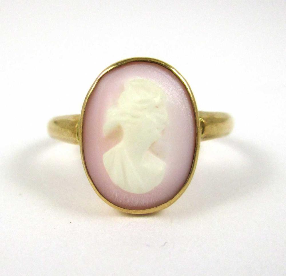 Appraisal: CAMEO AND TEN KARAT GOLD CHILD'S RING bezel set with