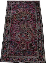 Appraisal: A Small Sarouk Carpet A red sarouk with natural abrash