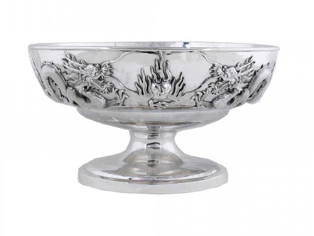 Appraisal: A CHINESE SILVER PUNCH BOWL applied with four repouss dragons