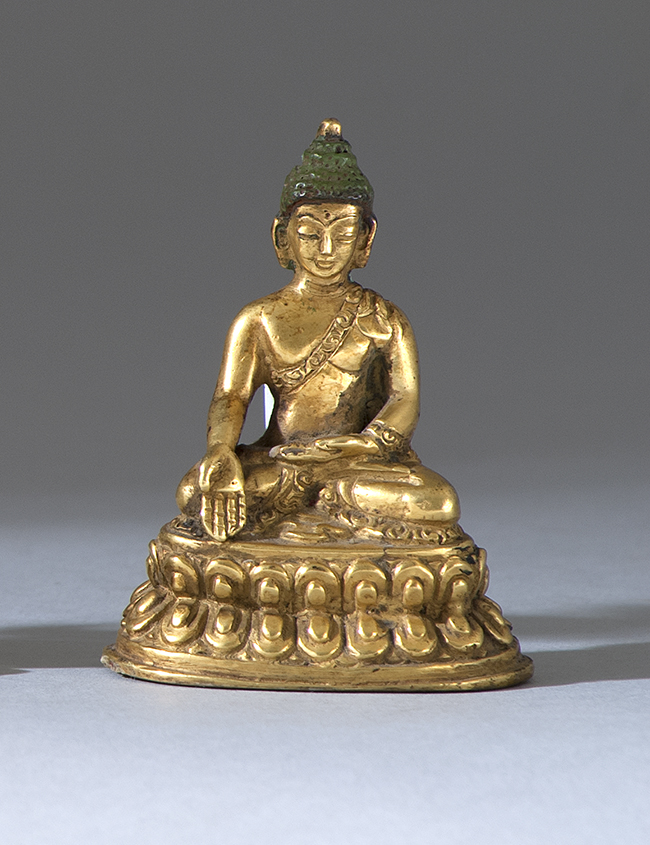 Appraisal: GILT-BRONZE FIGURE OF BUDDHA th th CenturySeated in earth-touching posture