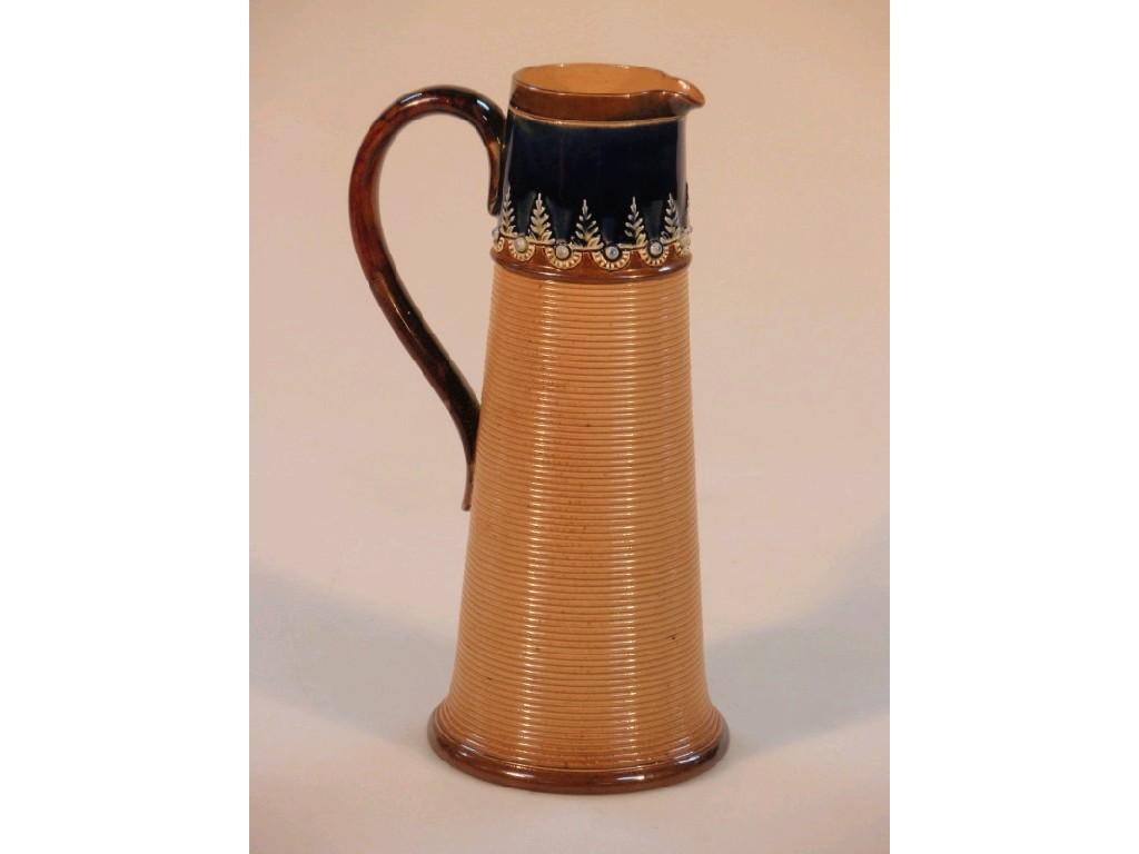 Appraisal: A Royal Doulton stoneware tapered cylindrical jug with a ribbed