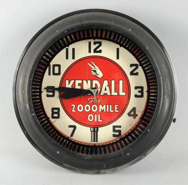 Appraisal: Kendall Oil Spinner Neon Clock s with neon that burns