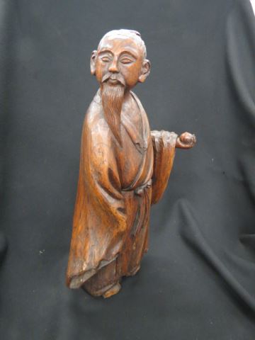 Appraisal: Chinese Carved Wood Figure of a Man fruit in hand