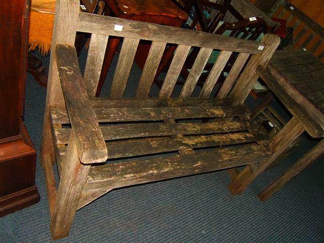 Appraisal: A small teak garden bench wide