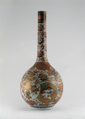 Appraisal: A large Japanese Imari bottle vase decorated with roundels of