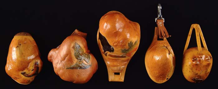 Appraisal: FIVE RELIEF CARVED AND PAINTED CANOE CUPS l with beaver