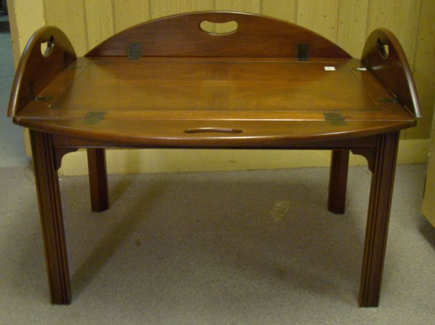 Appraisal: CHIPPENDALE -STYLE BUTLER'S TRAY COFFEE TABLE In mahogany with oval