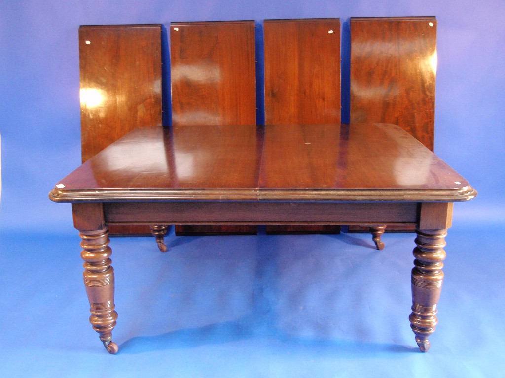 Appraisal: A Victorian walnut wind out dining table with four further